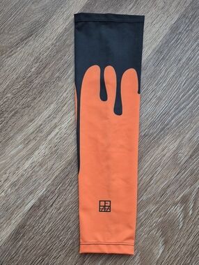 Boy's Black & Orange Compression Arm Sleeve. Size Youth Medium